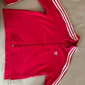 Pink adidas zip up jacket. Slits in the sides (at bottom) with a high-low effect